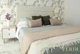 Bedroom headboard and leaf-pattern wallpaper — NOVA interior reference photograph