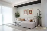 Living room with sofa and wall art — NOVA interior reference photograph