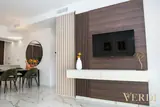Media wall and dining area — NOVA interior reference photograph