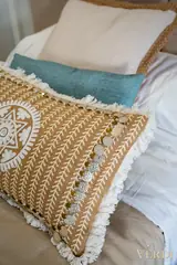 Patterned bedroom cushions — NOVA interior reference photograph