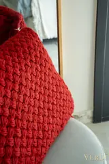 Red woven textile detail — NOVA interior reference photograph