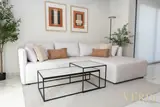 Sofa and nested coffee tables — NOVA interior reference photograph