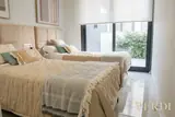 Twin bedroom by the window — NOVA interior reference photograph